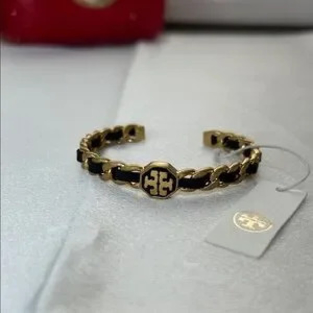 Brand new Tory Burch gold and black bracelet